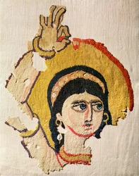 Fragment eines Wandteppichs, der den Kopf einer Tänzerin darstellt